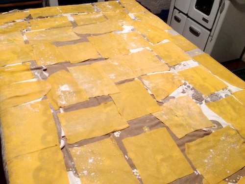 fresh lasagne noodles drying on the kitchen table